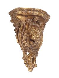 A Pair of Italian Giltwood Lion Motif Wall Brackets