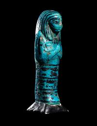 An Egyptian Blue Faience Ushabti for the Mistress of the House and Chantress of Amun, Muthotep