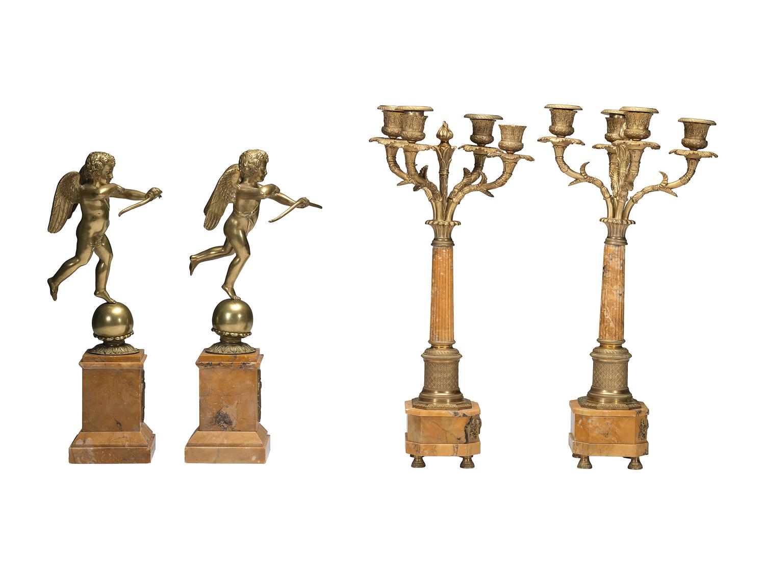 A Pair of Brass and Marble Cherub Bookends and Four-Light Candelabra