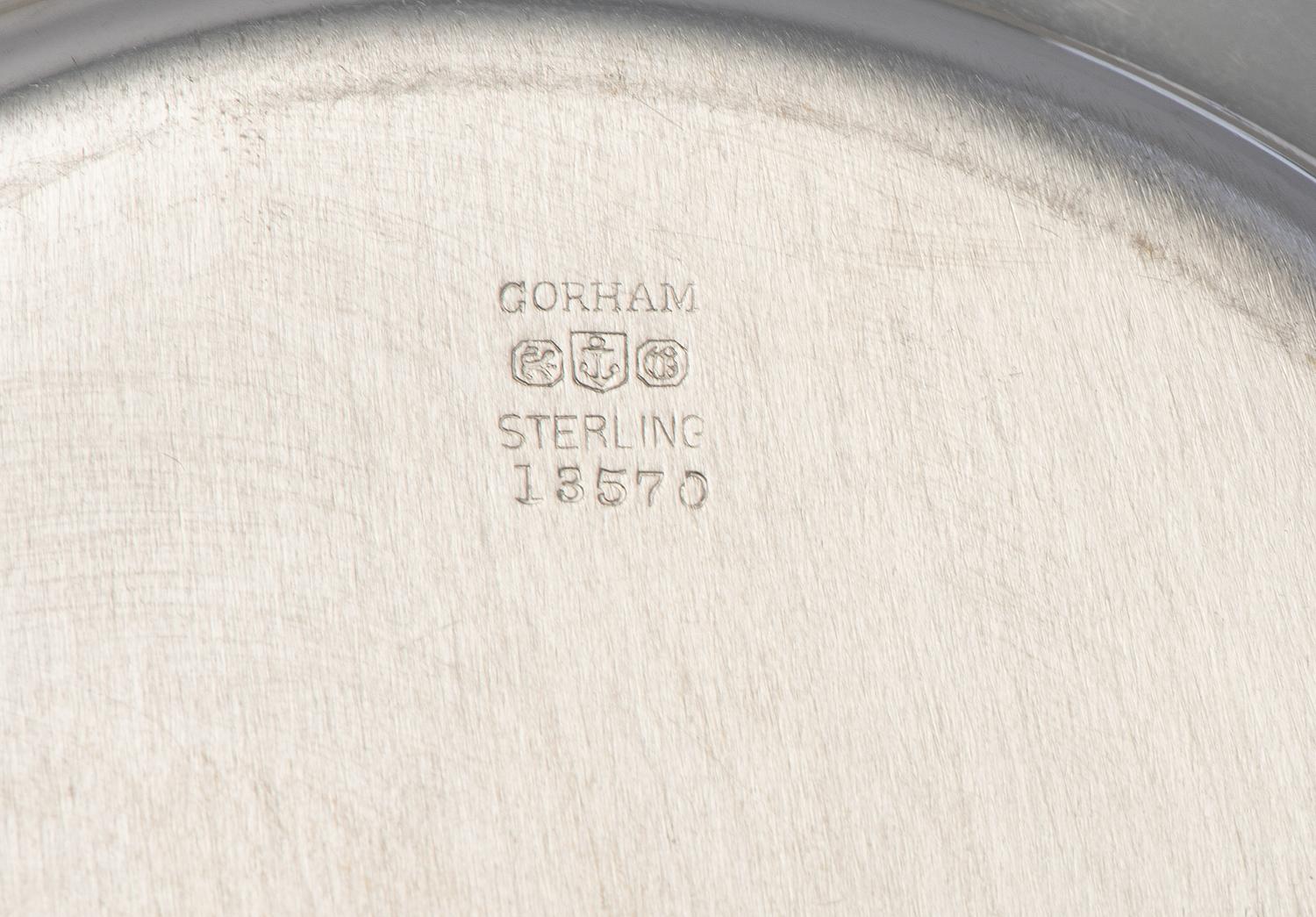 Eight American Silver Bread Plates