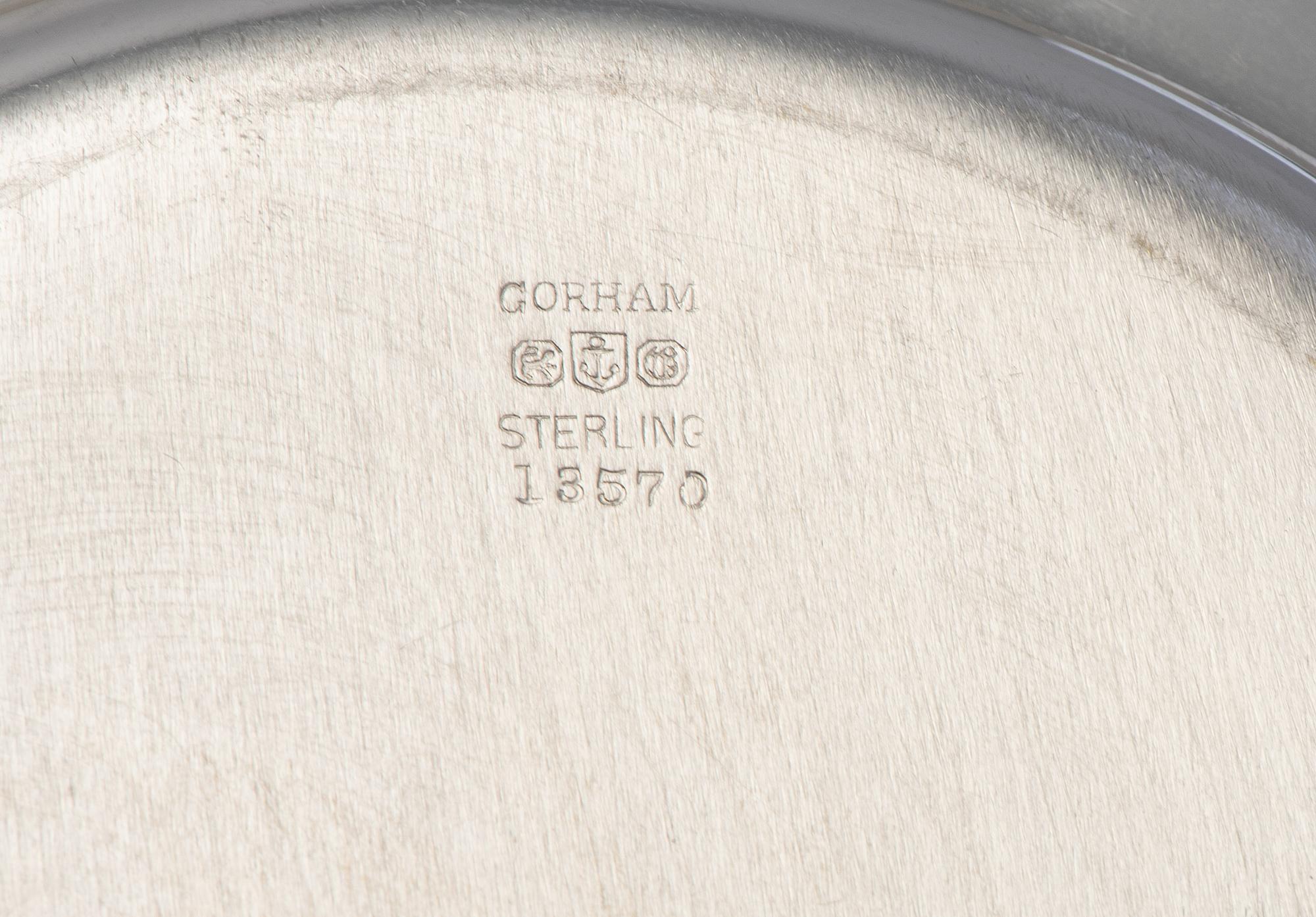 Eight American Silver Bread Plates