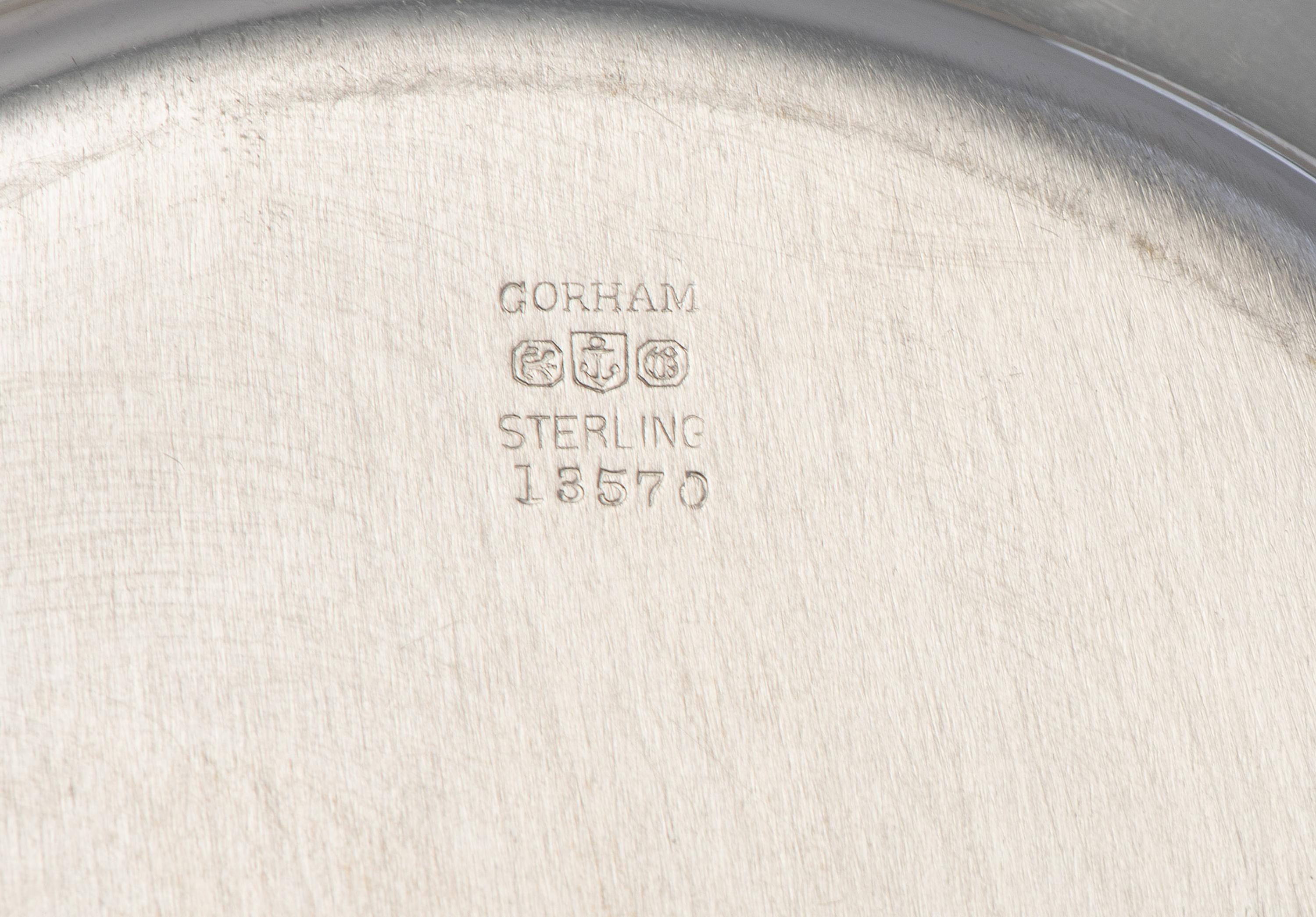 Eight American Silver Bread Plates