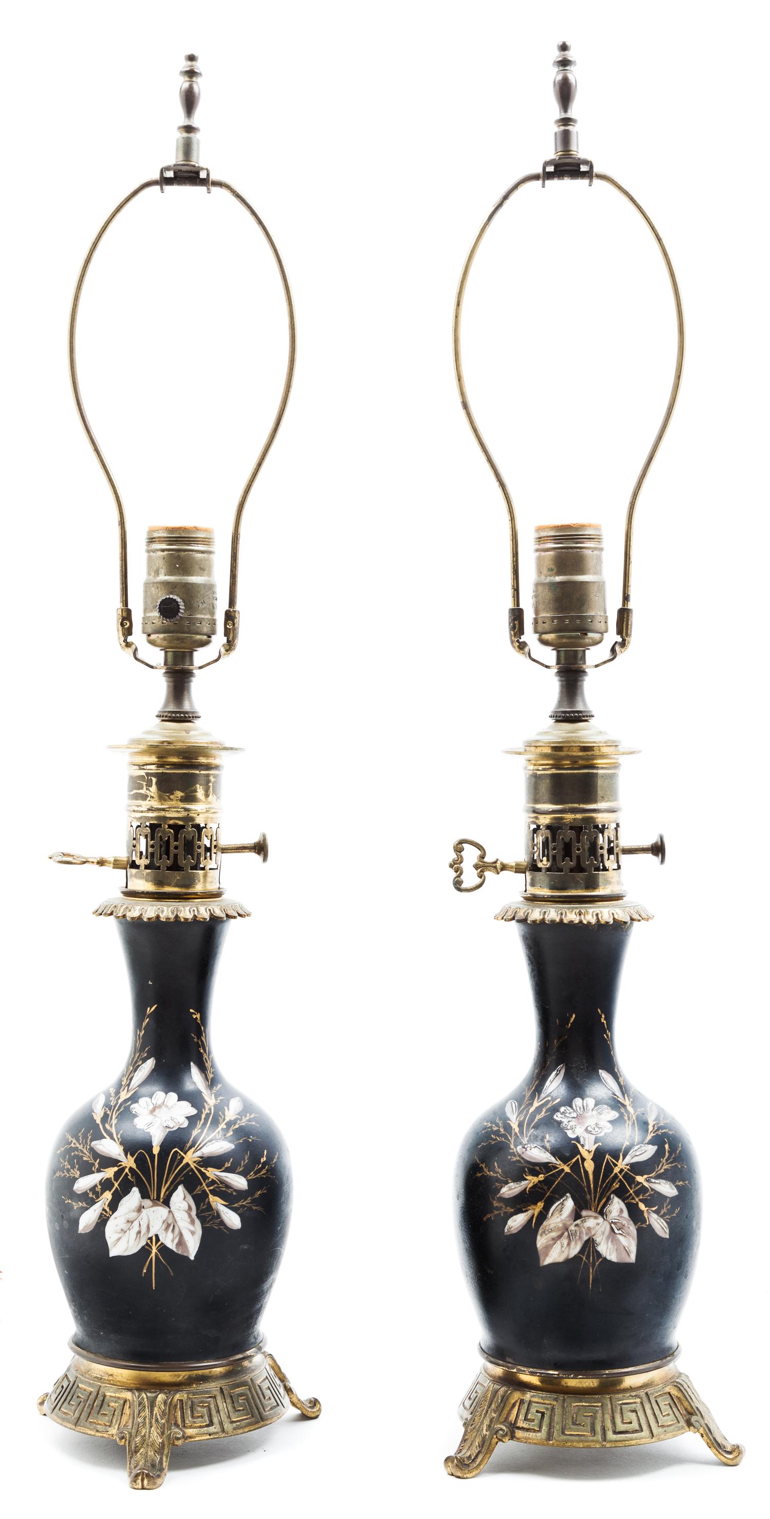 A Pair of Painted Ceramic Lamps Height overall 25 inches.