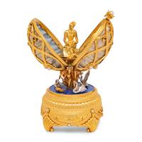 A Silver, Gilt and Enamel Decorated Swan Lake Egg-Form Music Box