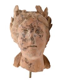 A Roman Style Terracotta Head of a Woman