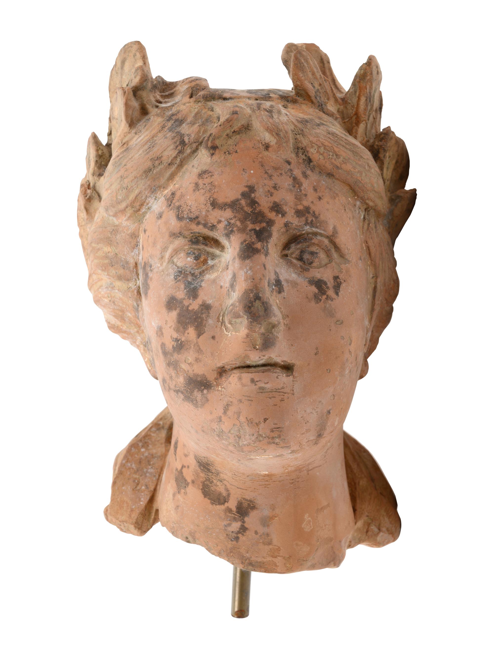 A Roman Style Terracotta Head of a Woman