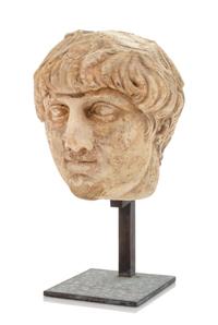 A Roman Marble Head of a Boy Height 7 inches. — CIRCA 2ND-3RD CENTURY B.C.E.