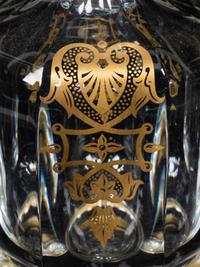 A Set of Three Baccarat Glass Decanters with Gilt Decoration