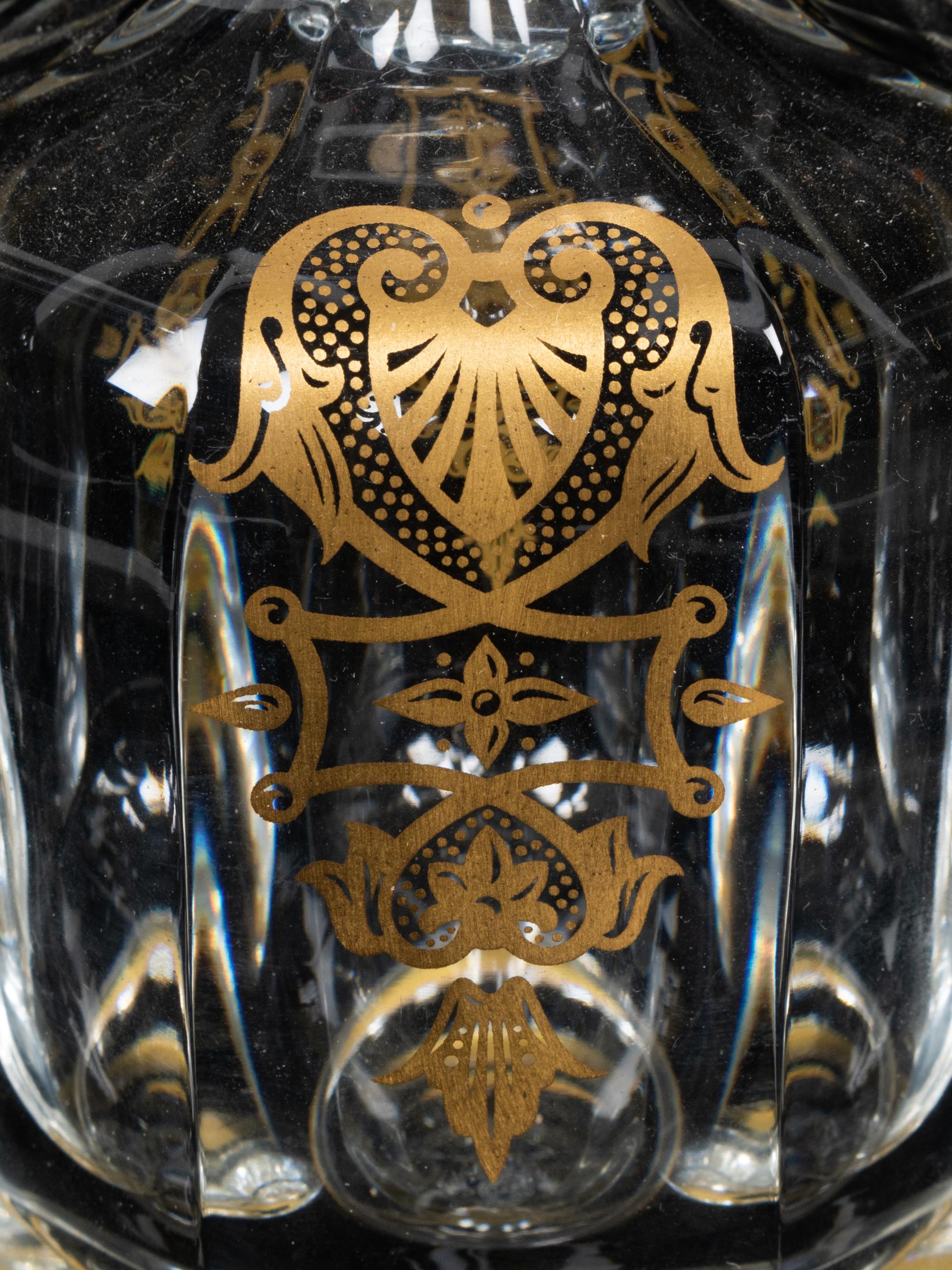 A Set of Three Baccarat Glass Decanters with Gilt Decoration