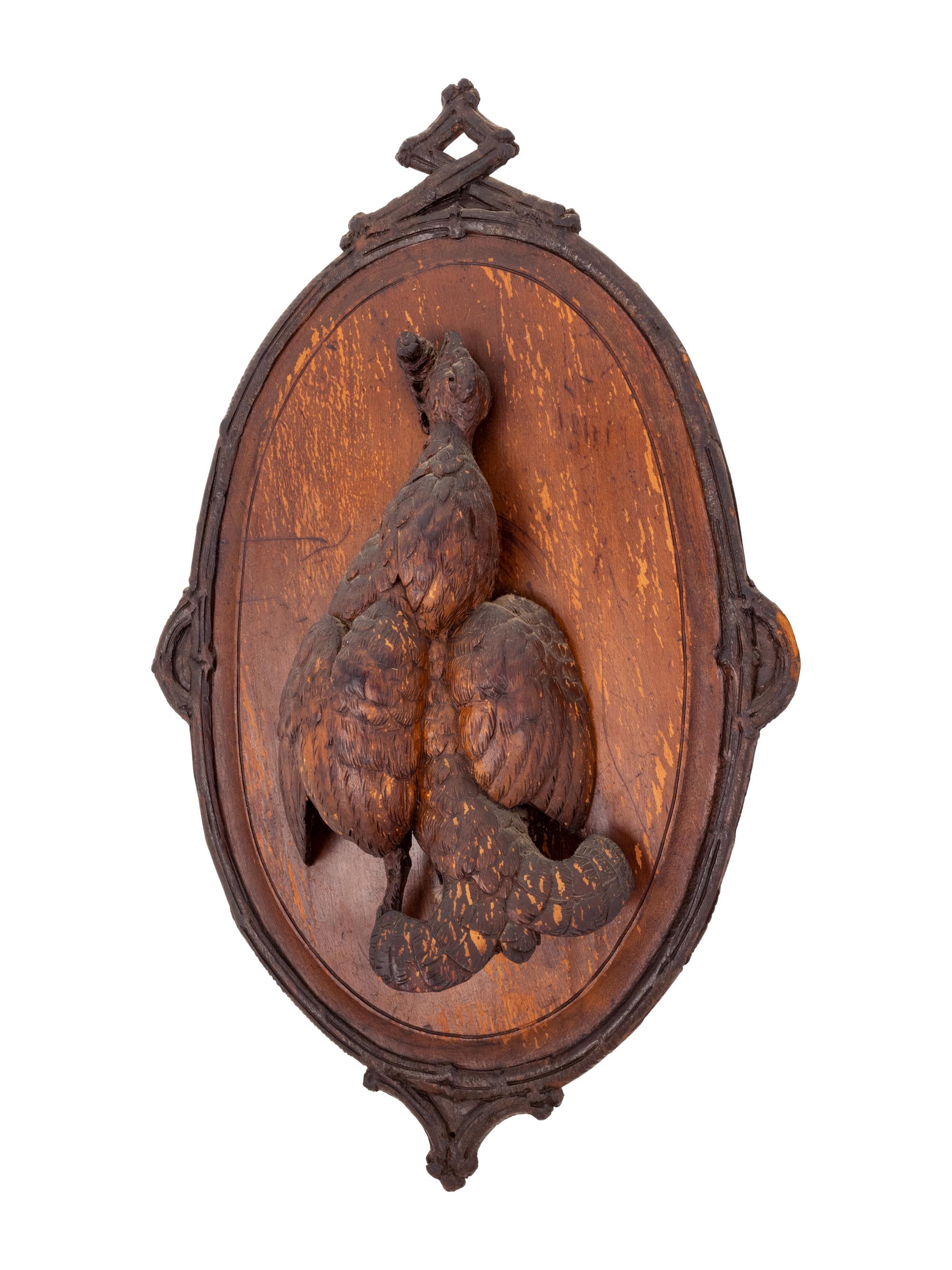 A Black Forest Carved Game Plaque