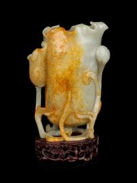 A Russet and Celadon Jade Lotus Cup
