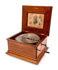 A Regina 15 1/2 Inch Disc Music Box with Inlay