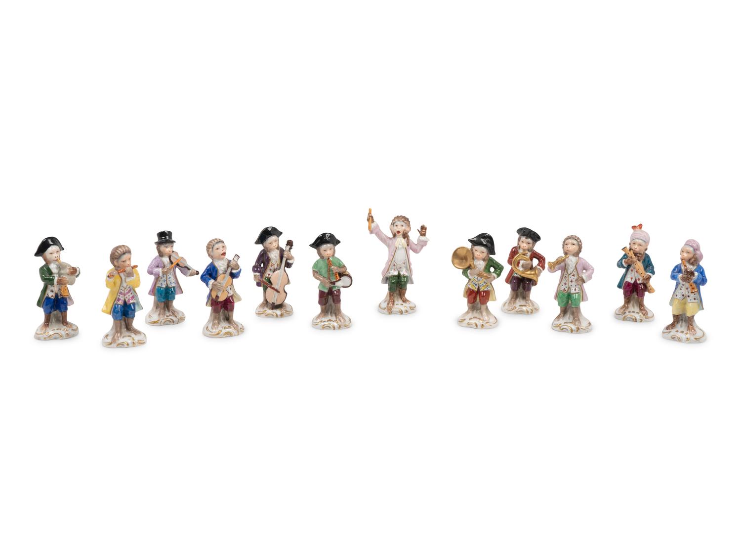 A German Porcelain Twelve-Piece Monkey Band