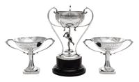 An English Silver Tennis Trophy, John Cook & Sons Ltd., Birmingham, 1930, in the form of a tennis player supporting the bowl, raised on