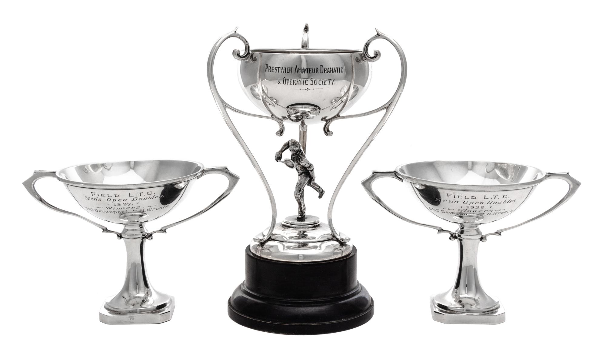 An English Silver Tennis Trophy, John Cook & Sons Ltd., Birmingham, 1930, in the form of a tennis player supporting the bowl, raised on