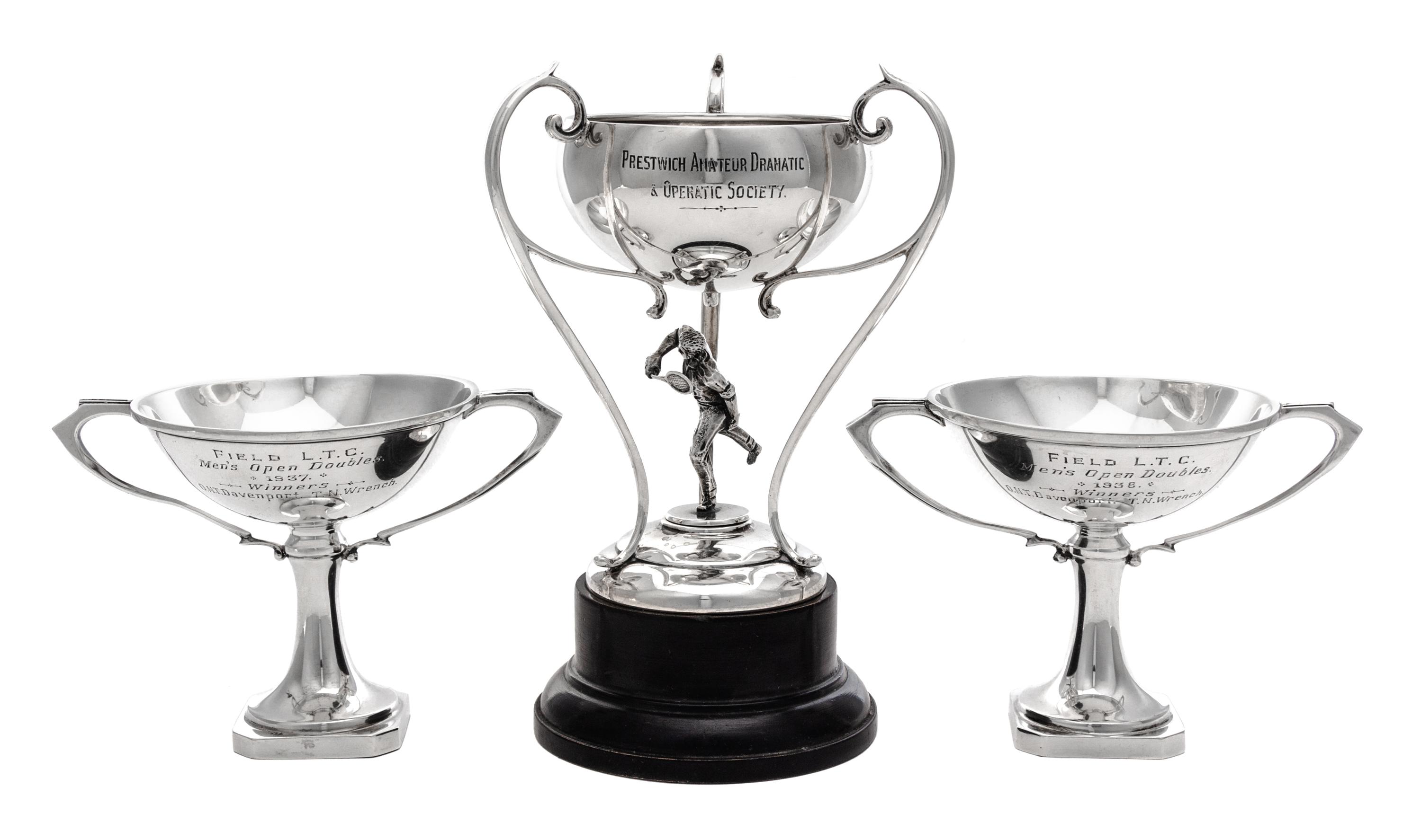An English Silver Tennis Trophy, John Cook & Sons Ltd., Birmingham, 1930, in the form of a tennis player supporting the bowl, raised on