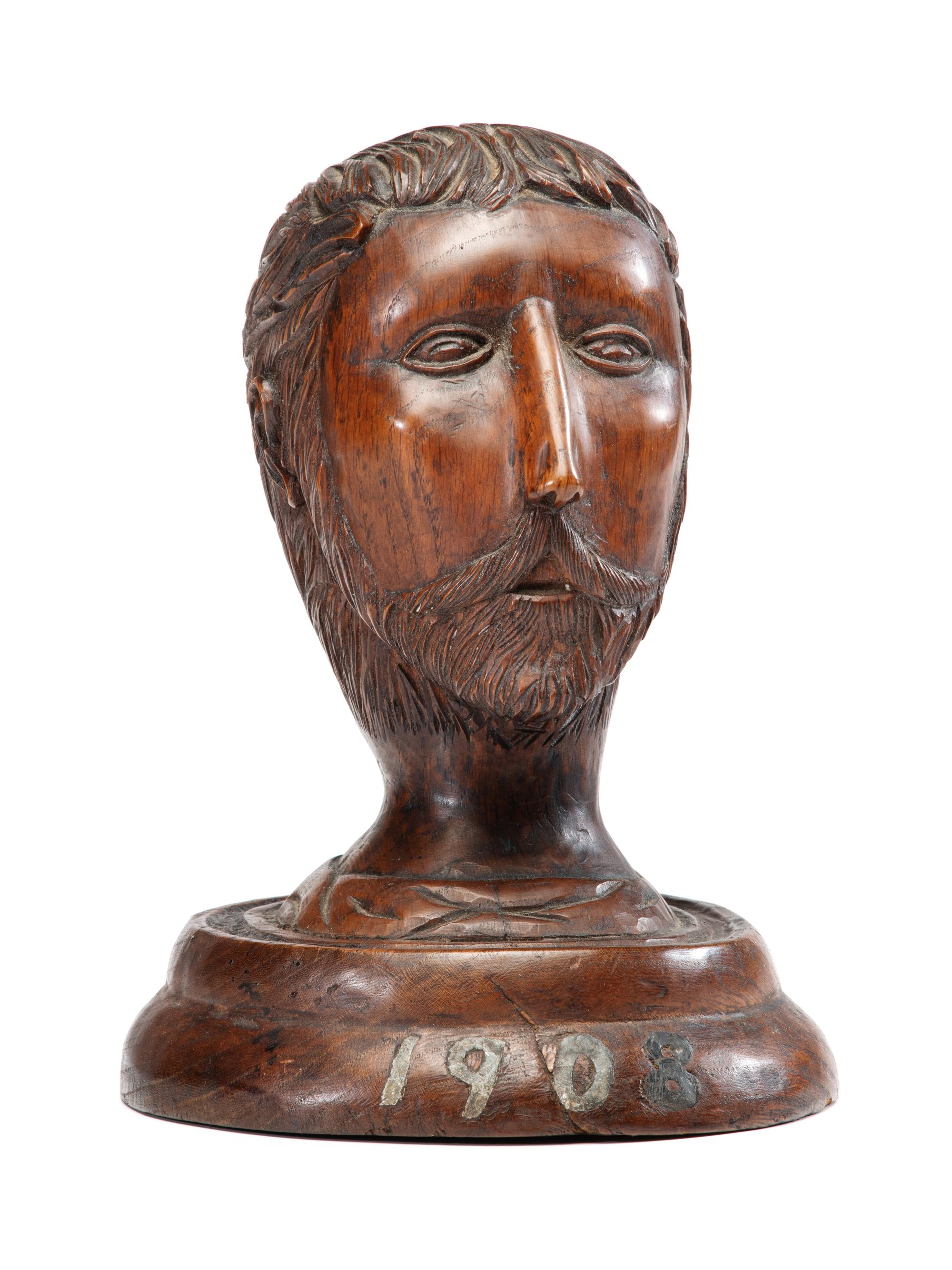 A Carved Wood Portrait Head