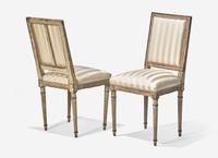 A Set of Six Louis XVI Cream-Painted and Parcel Gilt Dining Chairs
