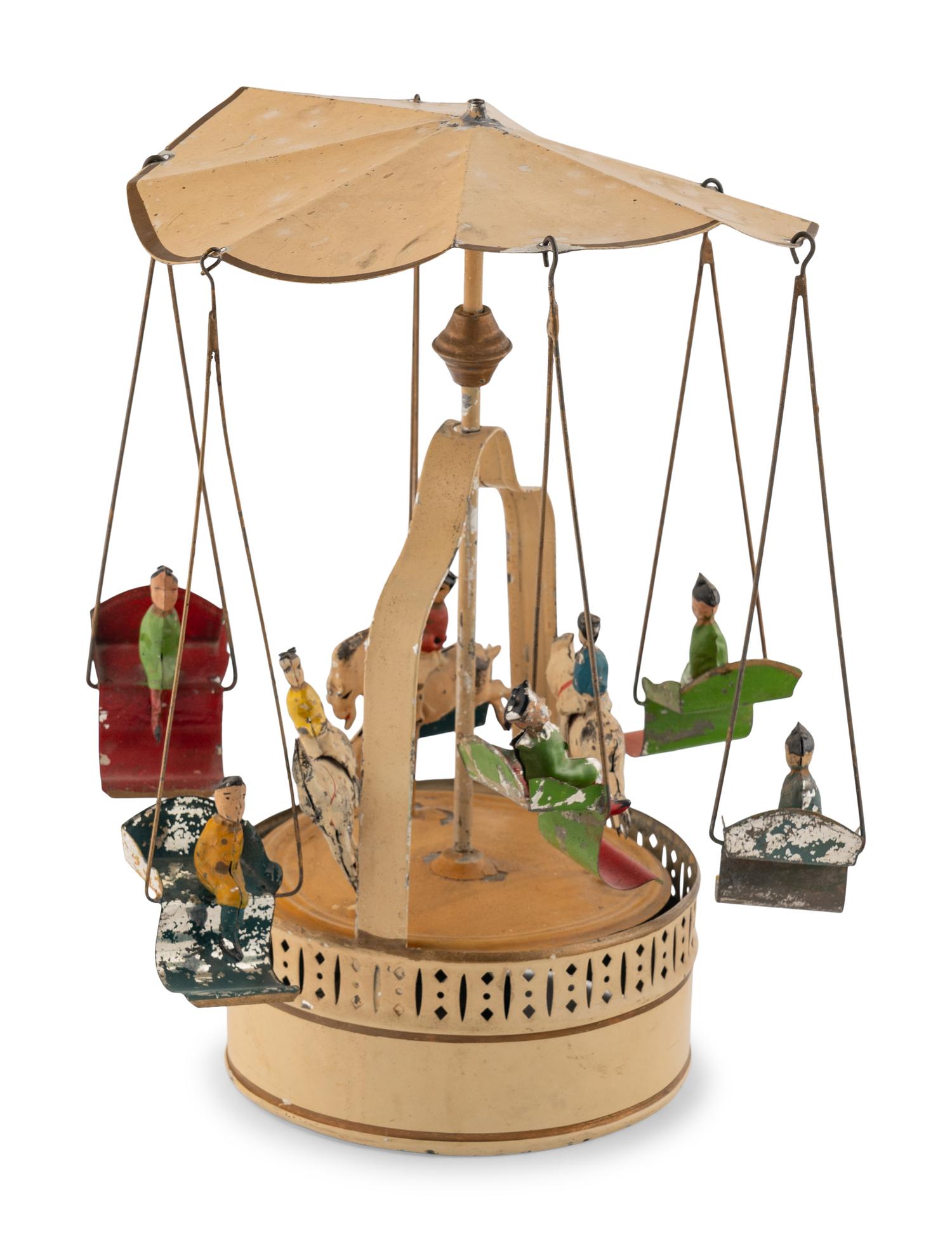 A German Painted Tin Swing Carousel Toy