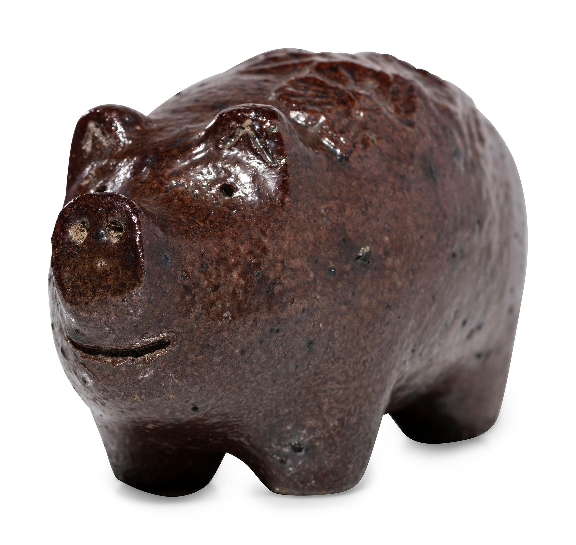 An Ohio Brown-Glazed Sewer Tile Pig