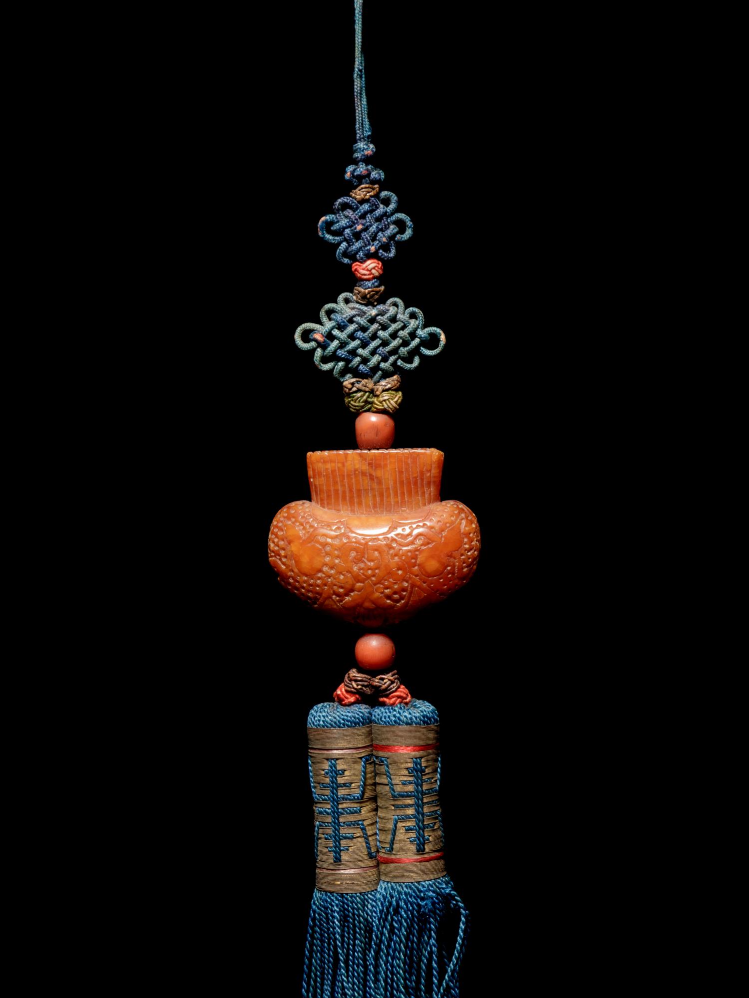 A Beewax Purse-Form Pendant