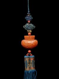 A Beewax Purse-Form Pendant