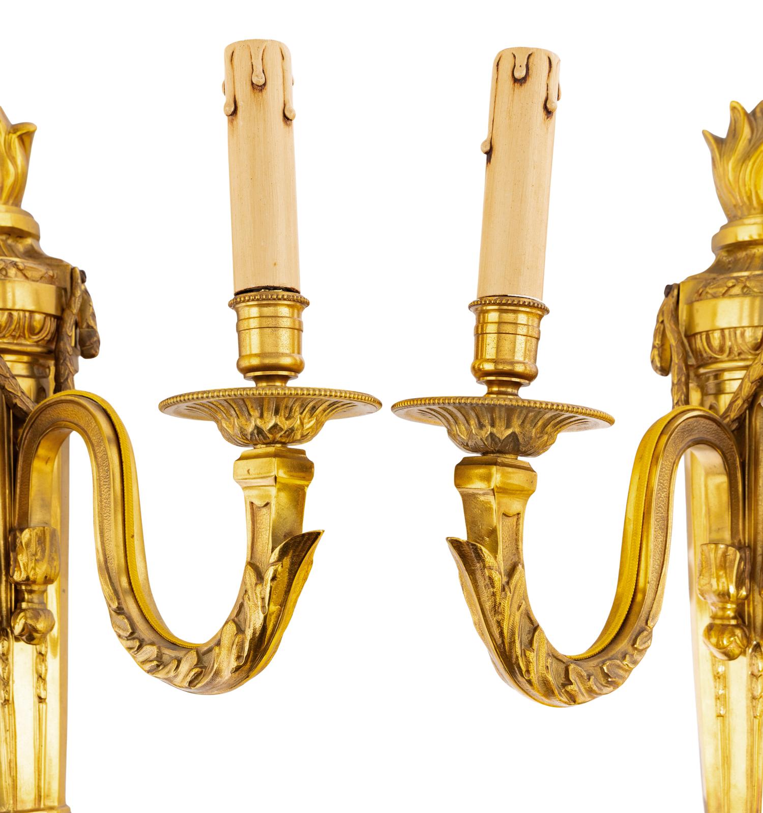 A Pair of Louis XVI Gilt Bronze Three-Light Sconces