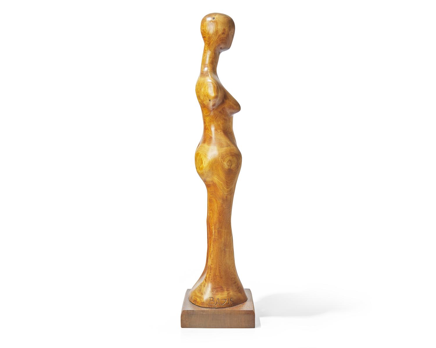 Tom Bazis (b. 1943), A wood carving of a female figure