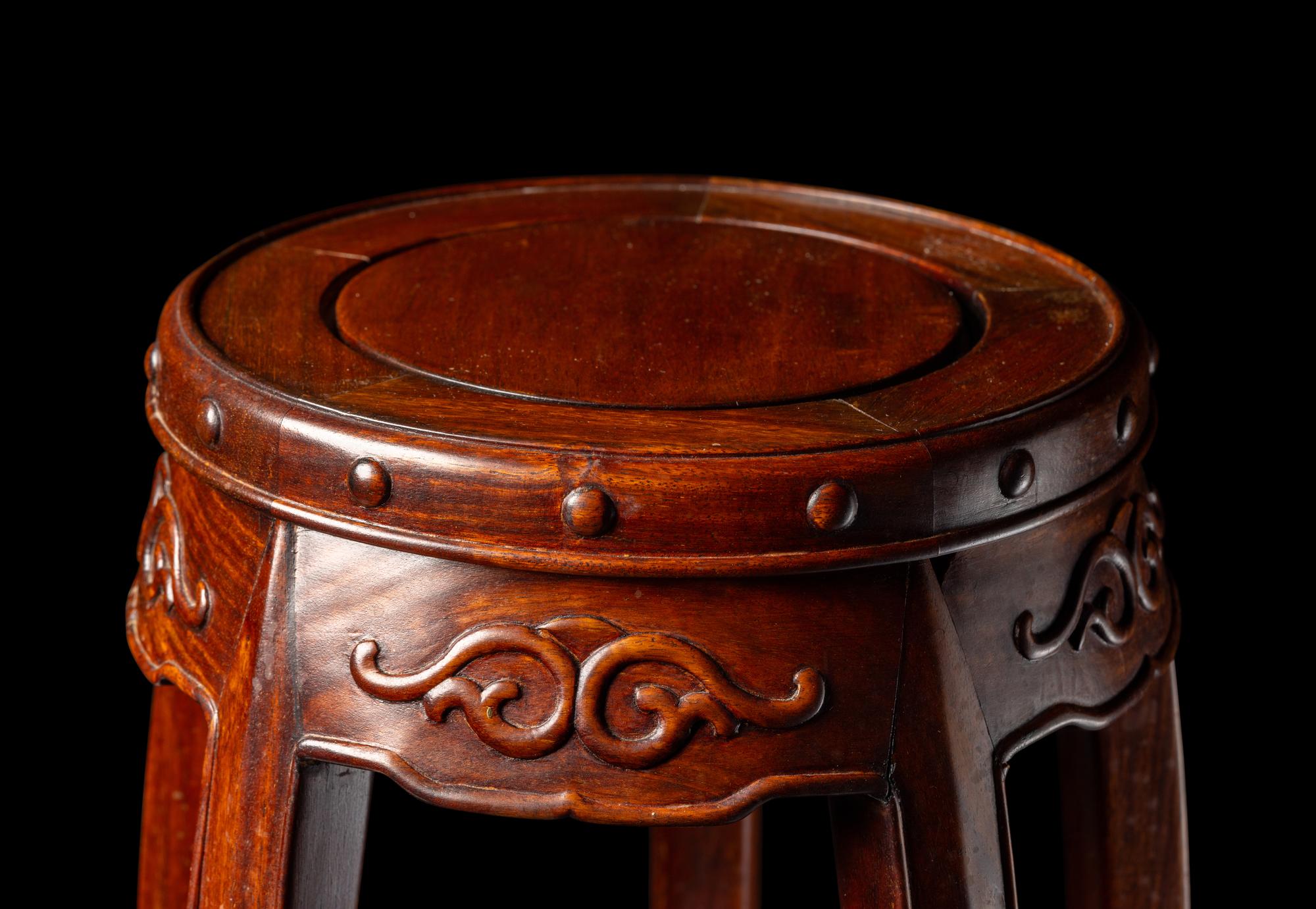 A Chinese Hardwood Barrel-Form Stand, Huaji