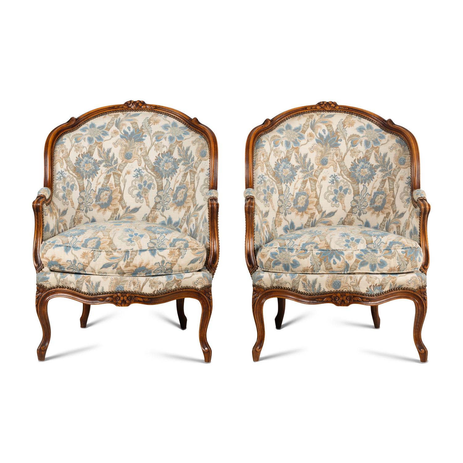 A Pair of Louis XV Style Walnut Bergères