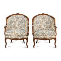 A Pair of Louis XV Style Walnut Bergères