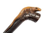 A Carved Wood Zoomorphic Walking Stick