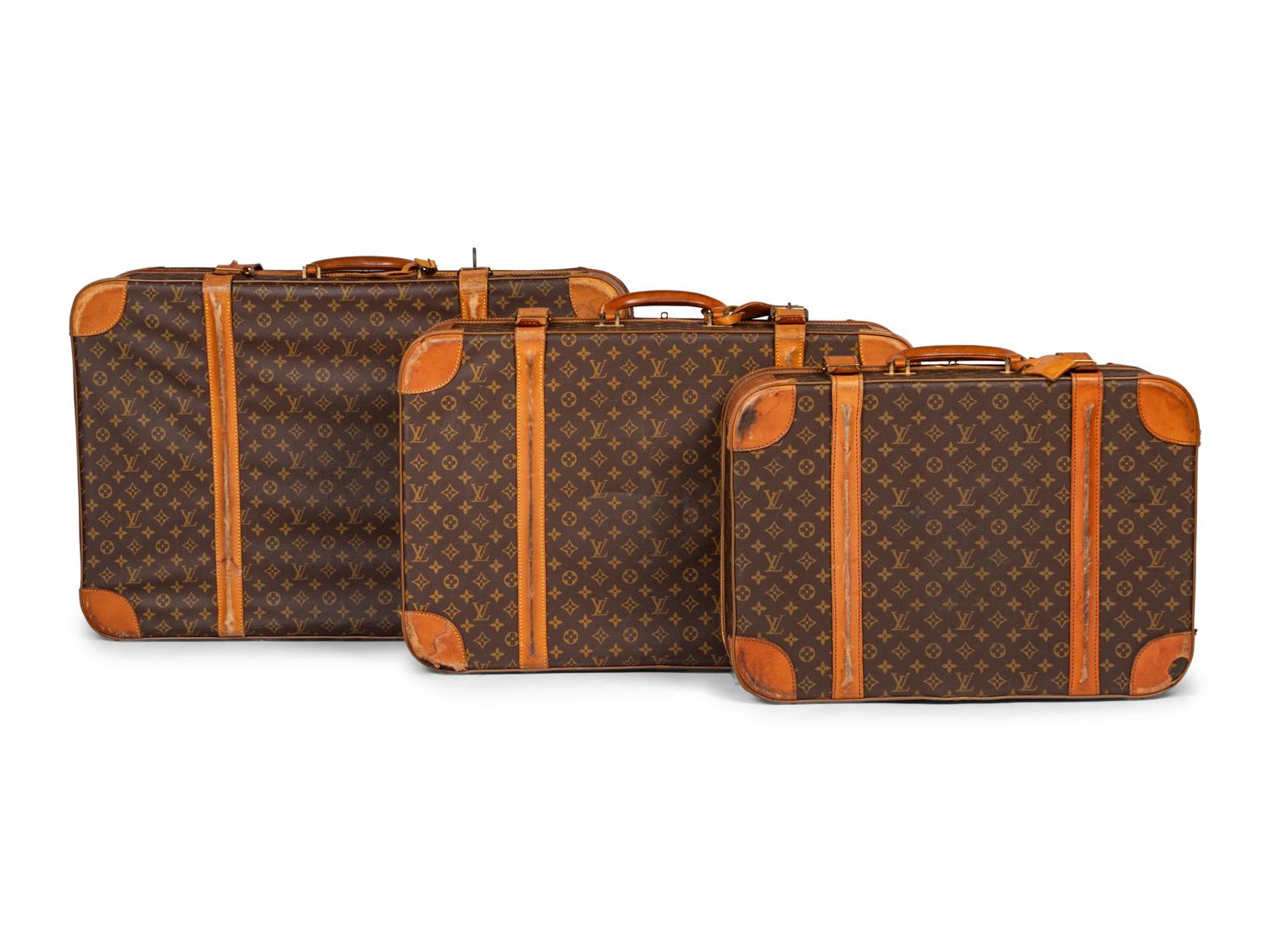 A Group of Three Louis Vuitton Soft-Sided Suitcases, 20th Century