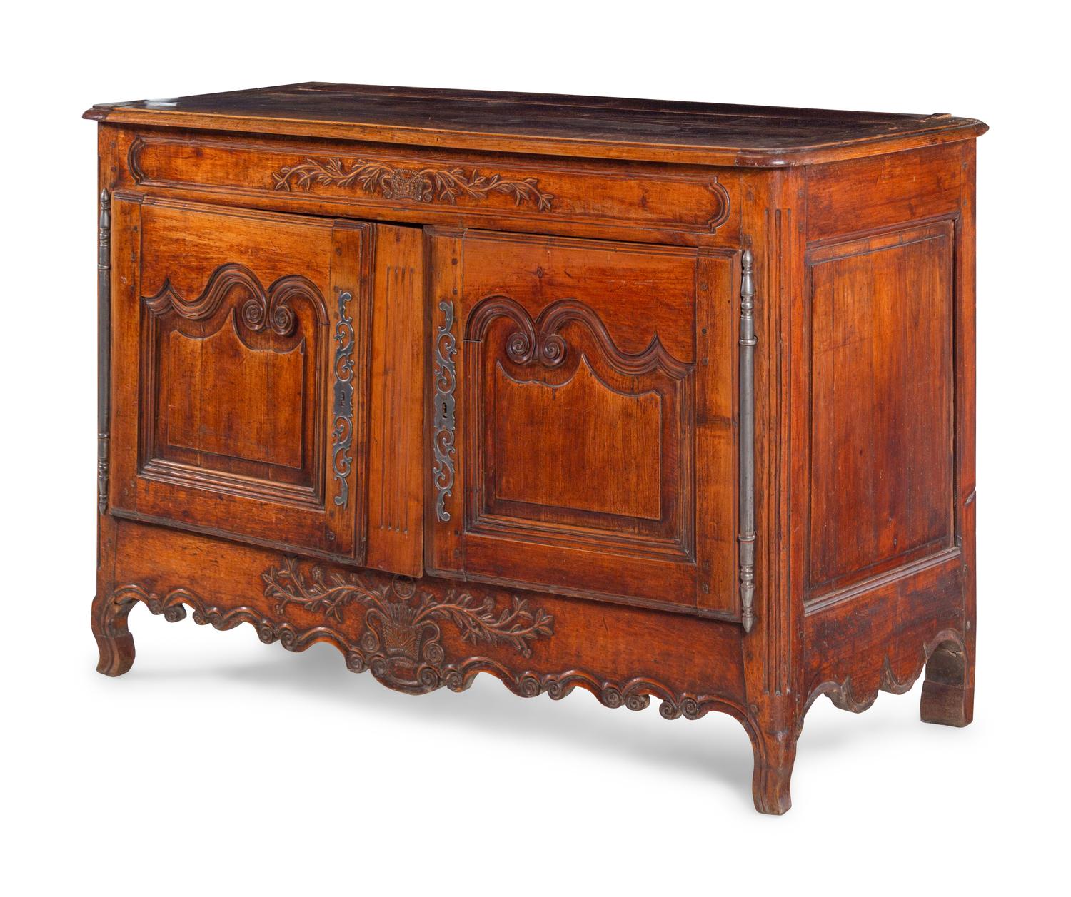 A Louis XV Provincial Carved Walnut Cabinet