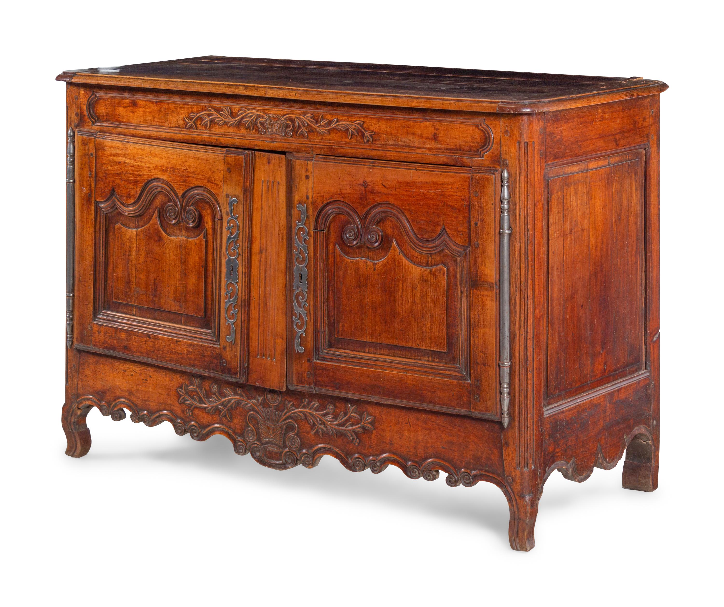 A Louis XV Provincial Carved Walnut Cabinet