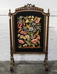 A Louis XVI Style Needlepoint Firescreen Height 43 1/2 x width 25 inches.