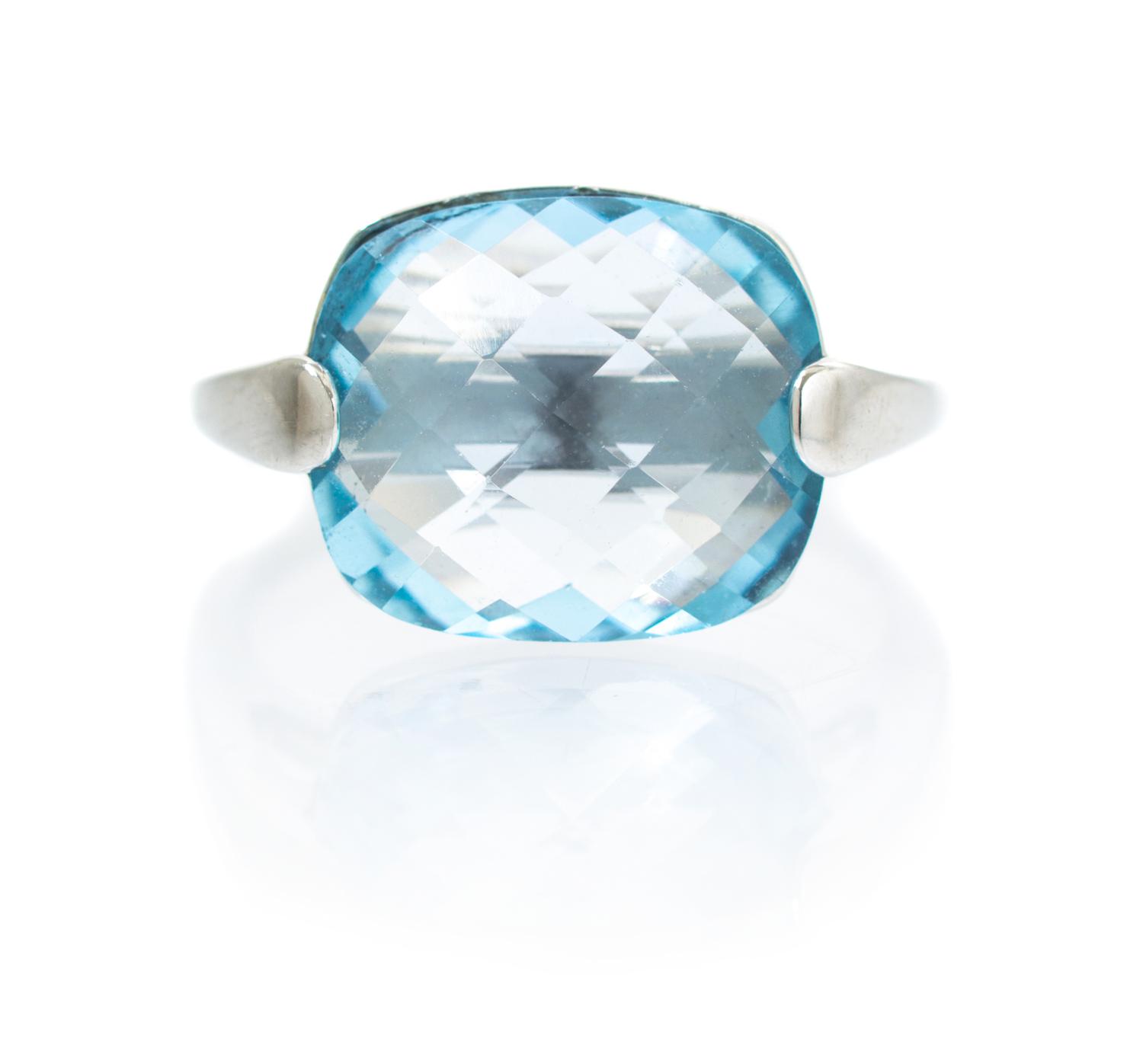 A 14 Karat White Gold and Blue Topaz Ring, 3.20 dwts.