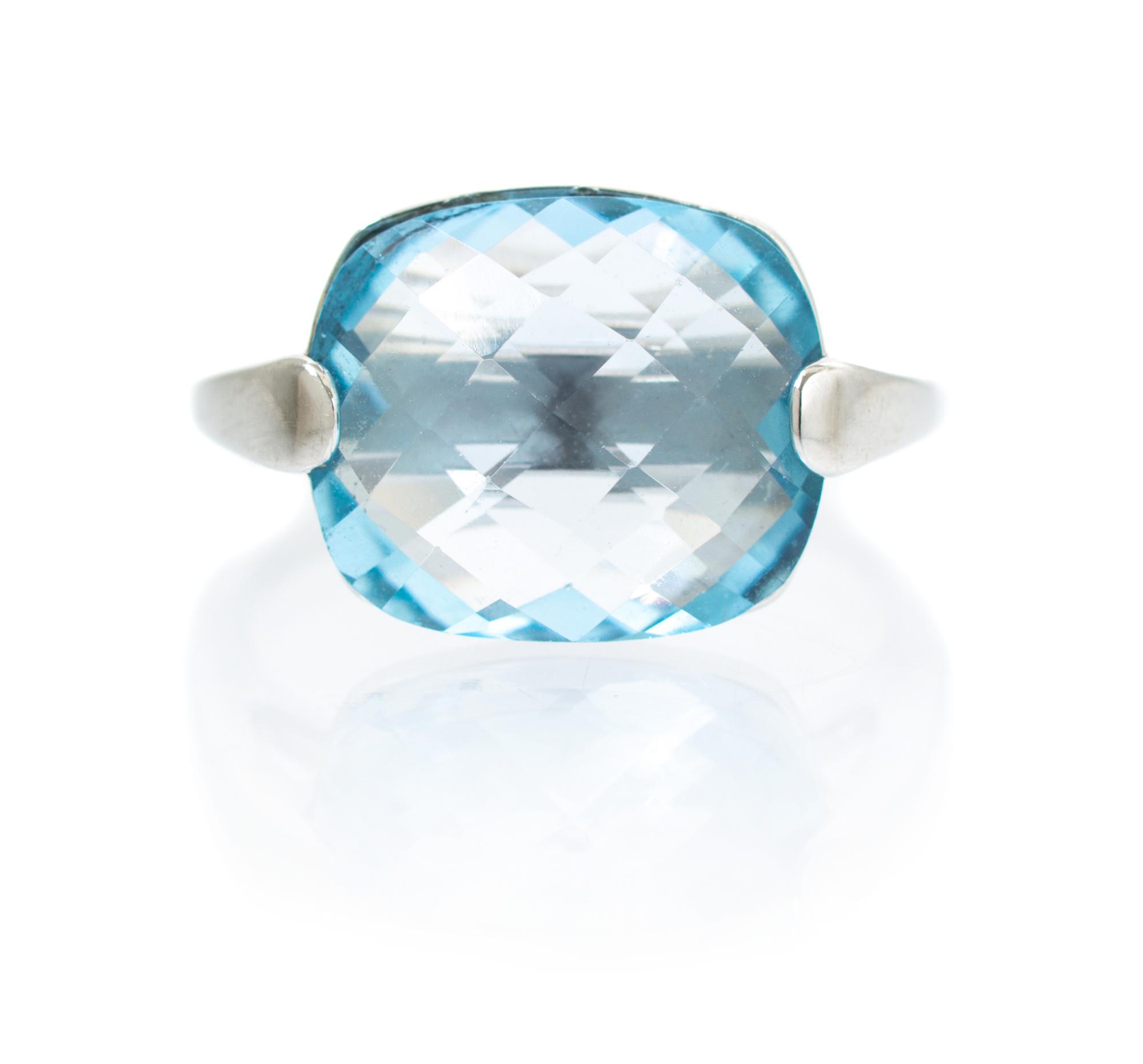 A 14 Karat White Gold and Blue Topaz Ring, 3.20 dwts.