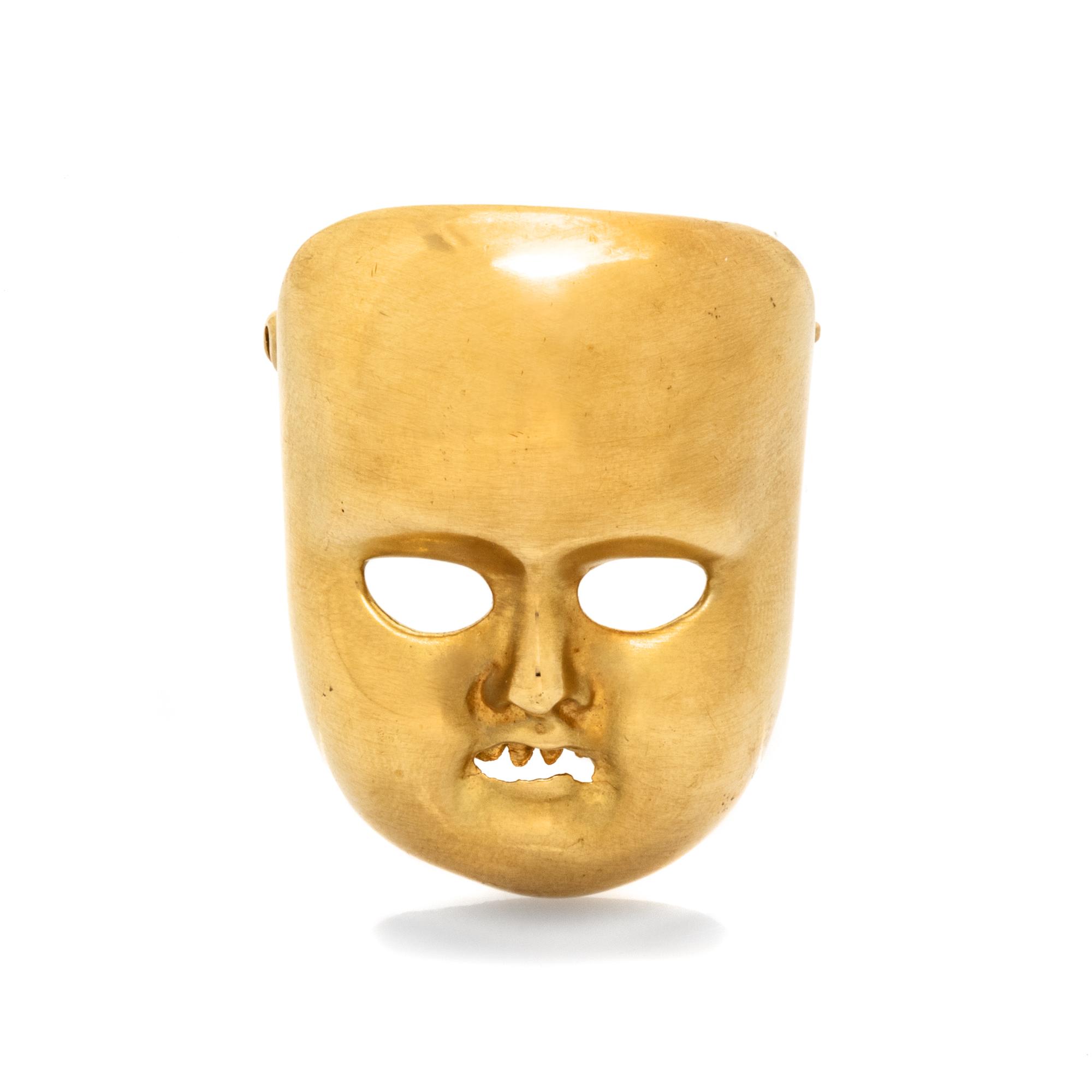 KIESELSTEIN-CORD, YELLOW GOLD MASK BROOCH