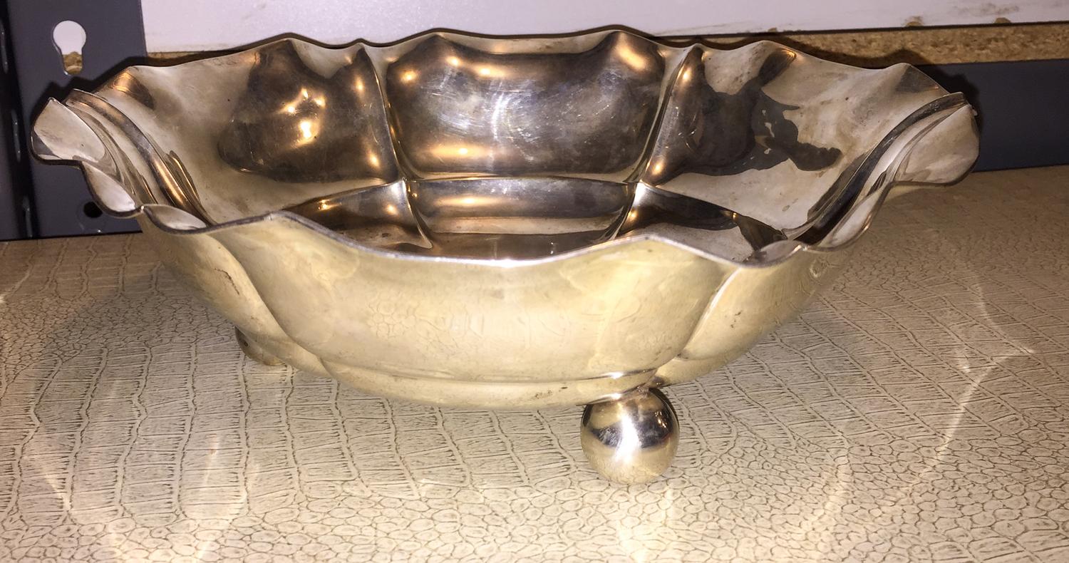 A German Silver Footed Bowl, Hugo Bohm, Schwabisch Gmund, having a scalloped rim and ribbed body, raised on three ball feet.
