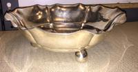 A German Silver Footed Bowl, Hugo Bohm, Schwabisch Gmund, having a scalloped rim and ribbed body, raised on three ball feet.