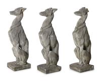A Group of Cast Stone Hound Form Garden Statues