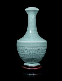 A Chinese Carved Celadon Glazed Porcelain Vase
