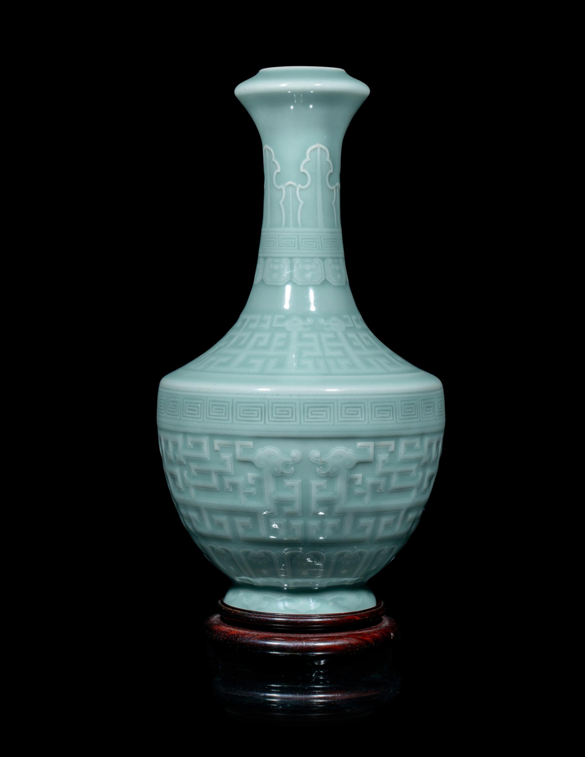 A Chinese Carved Celadon Glazed Porcelain Vase
