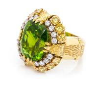 An 18 Karat Yellow Gold, Cushion Cut Peridot, Yellow and White Diamond Ring, 17.40 dwts.
