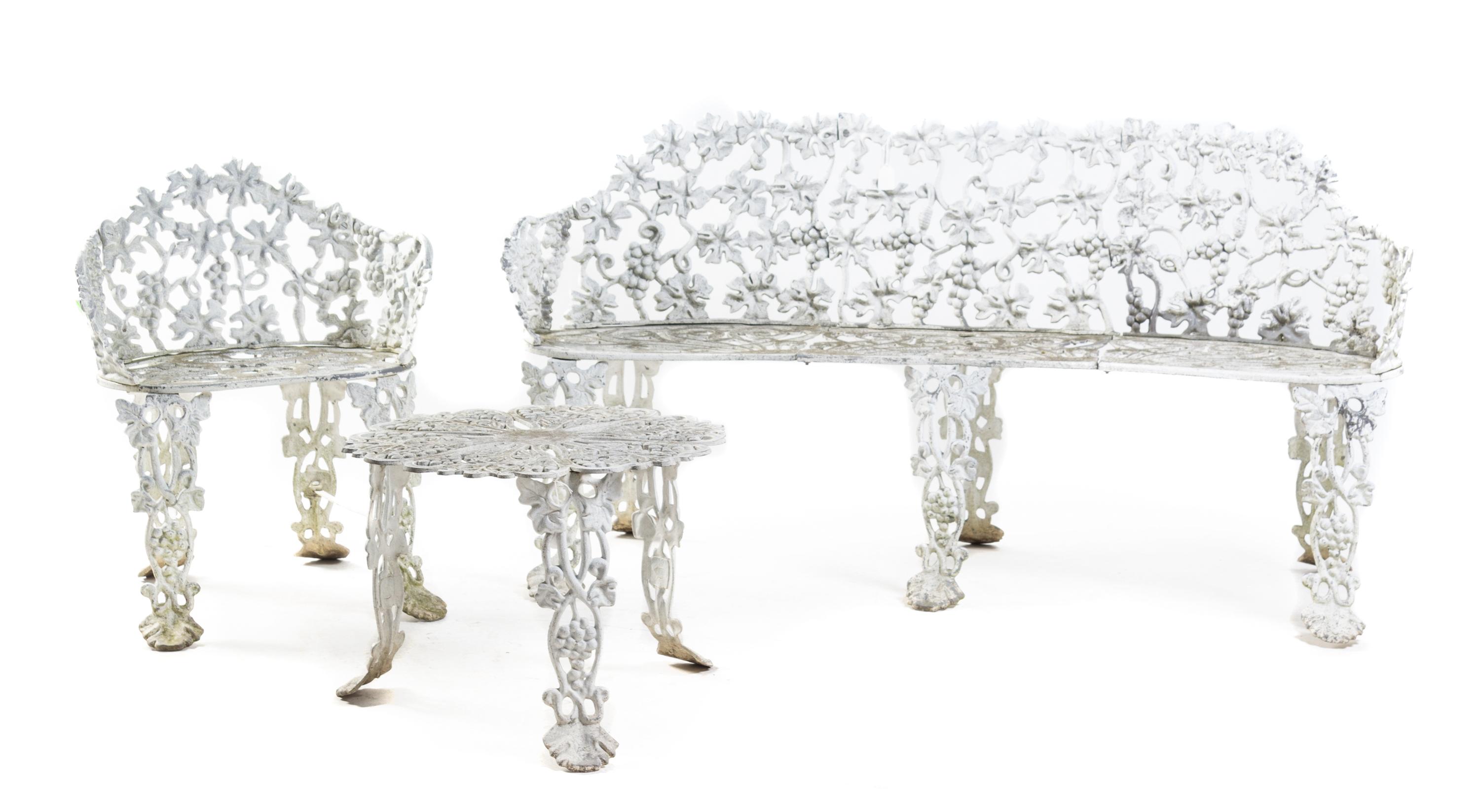 An Assembled Suite of Victorian Wrought Iron Garden Furniture Width of settee 66 inches. — 19TH/20TH CENTURY