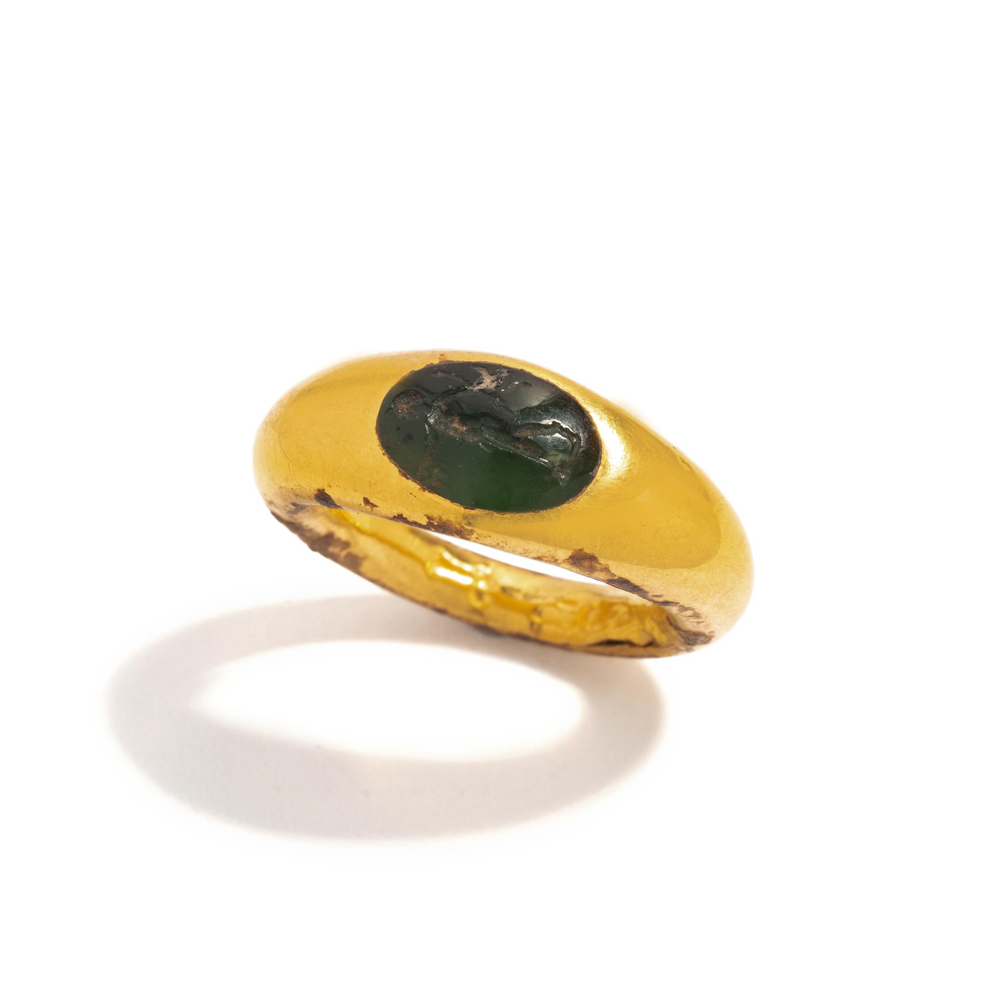 A Roman Gold and Plasma Finger Ring with the God Eros