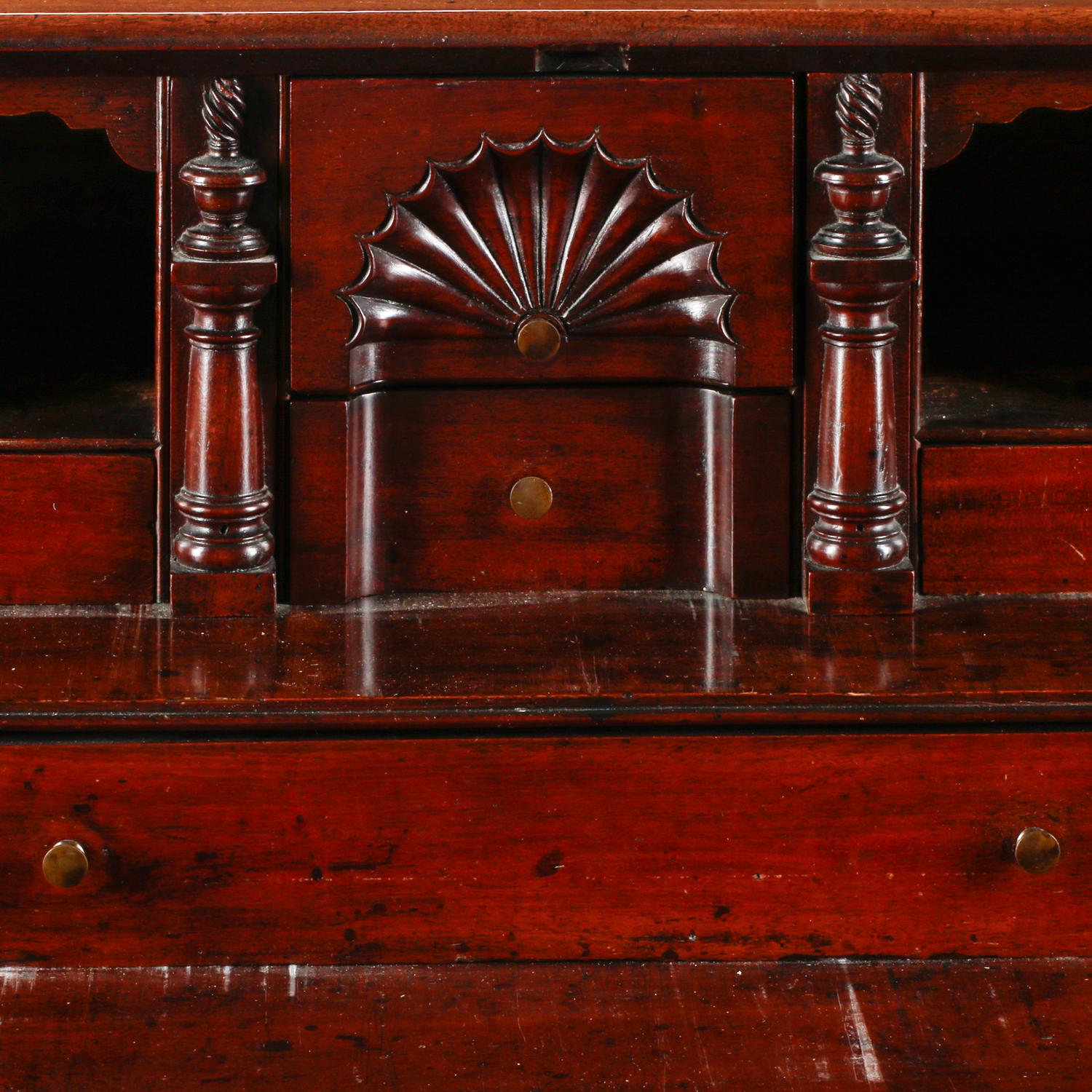 A Chippendale Figured and Fan-Carved Mahogany Serpentine Slant-Front Desk