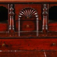 A Chippendale Figured and Fan-Carved Mahogany Serpentine Slant-Front Desk