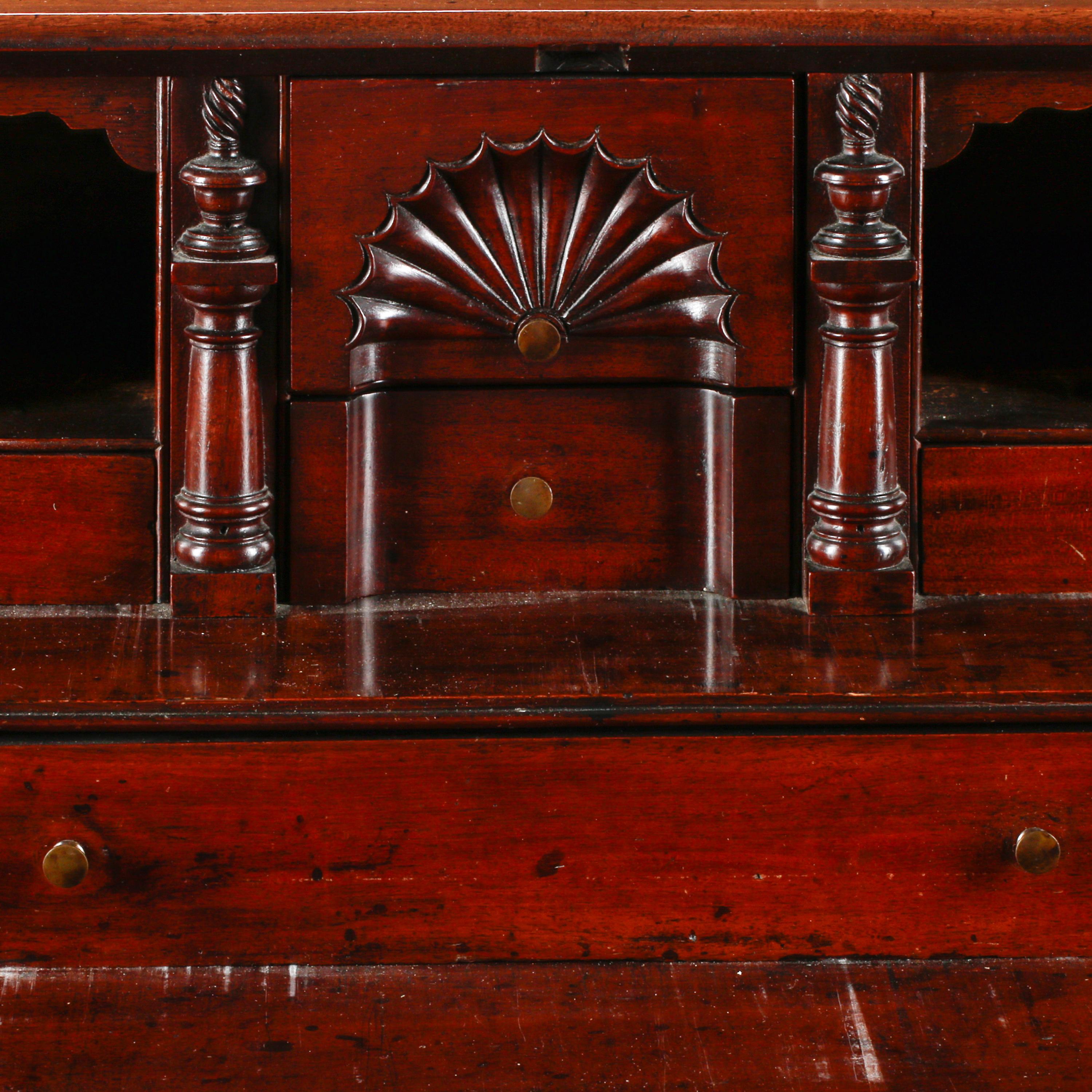A Chippendale Figured and Fan-Carved Mahogany Serpentine Slant-Front Desk